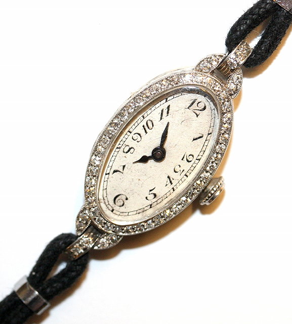 Appraisal: A 'S DIAMOND SET LADIES WRIST WATCH oval shaped with