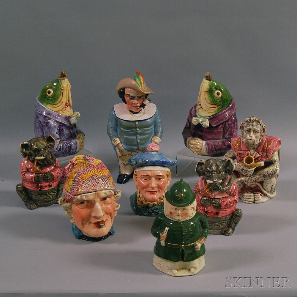 Appraisal: Nine Ceramic Figural Tobacco Jars four men a pair of