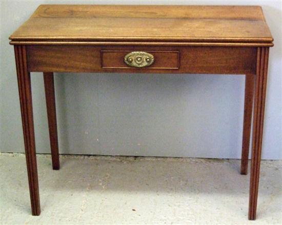 Appraisal: George III mahogany tea table with foldover top and a