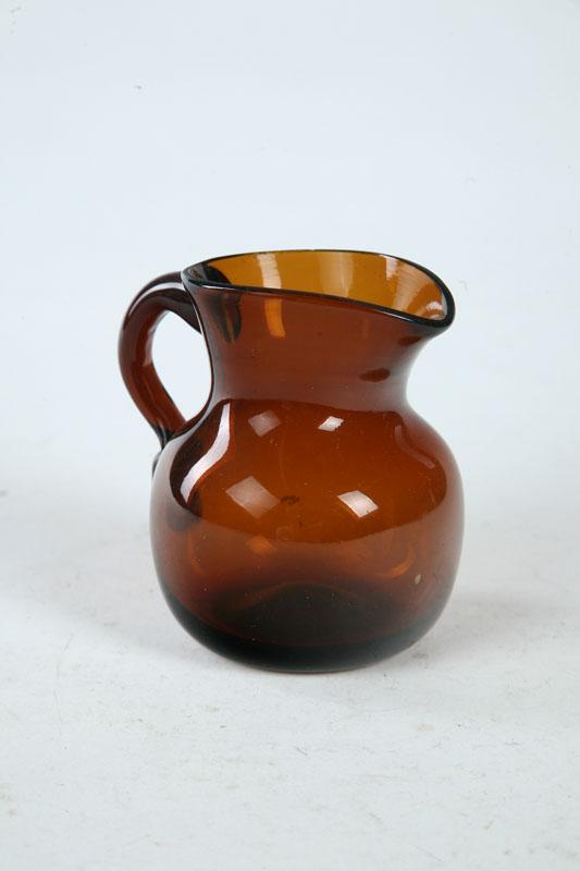 Appraisal: AMBER GLASS CREAMER Attributed to New York st half- th