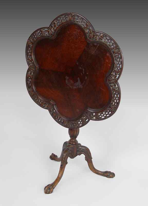 Appraisal: CARVED MAHOGANY BALL AND CLAW FOOT TILT TOP TEA TABLE