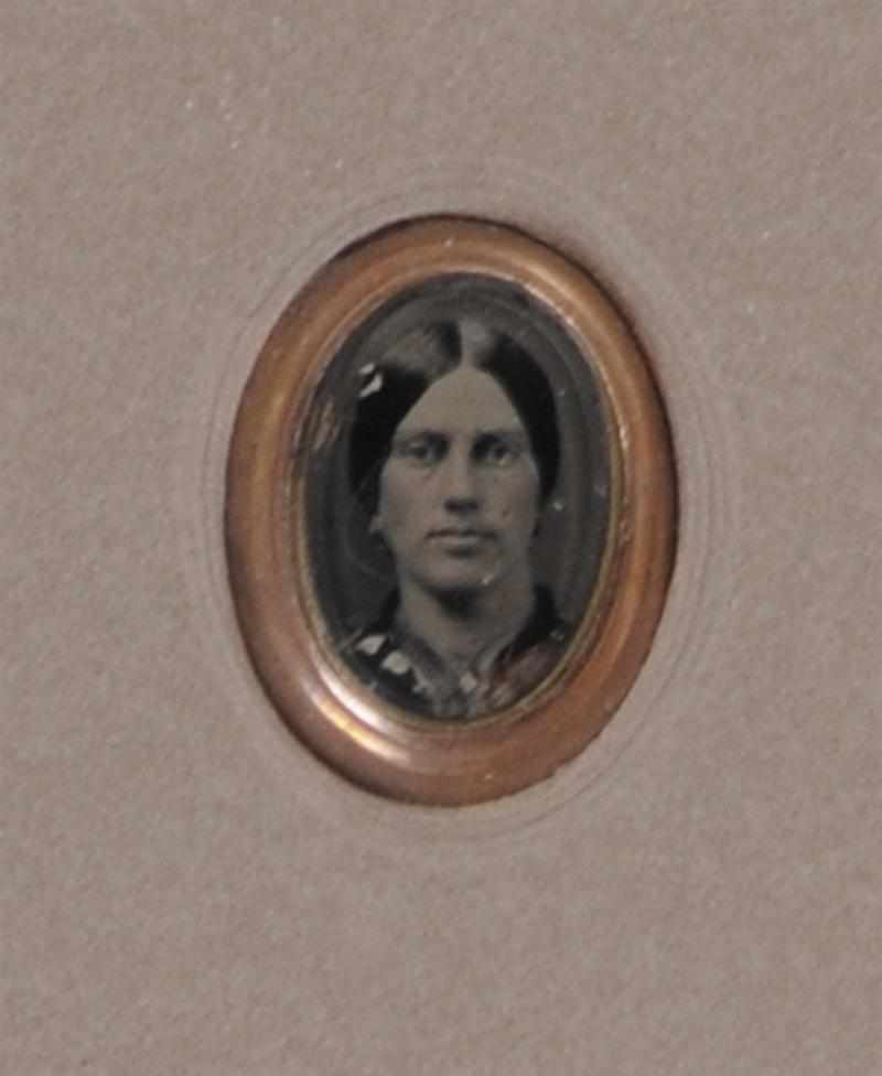 Appraisal: UNKNOWN C PORTRAIT OF A WOMAN Tintype in a gold