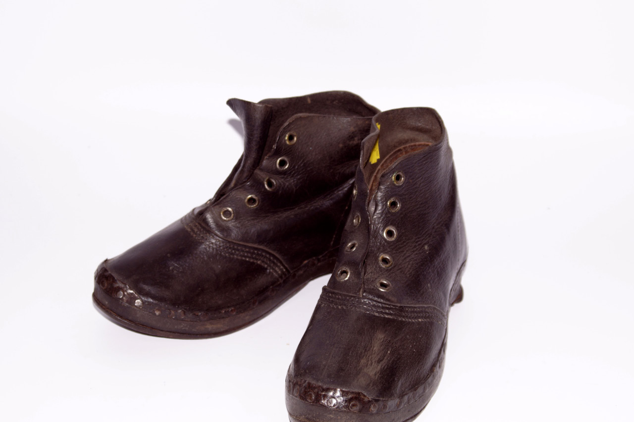 Appraisal: A pair of thC leather boots with blacksmith made metal