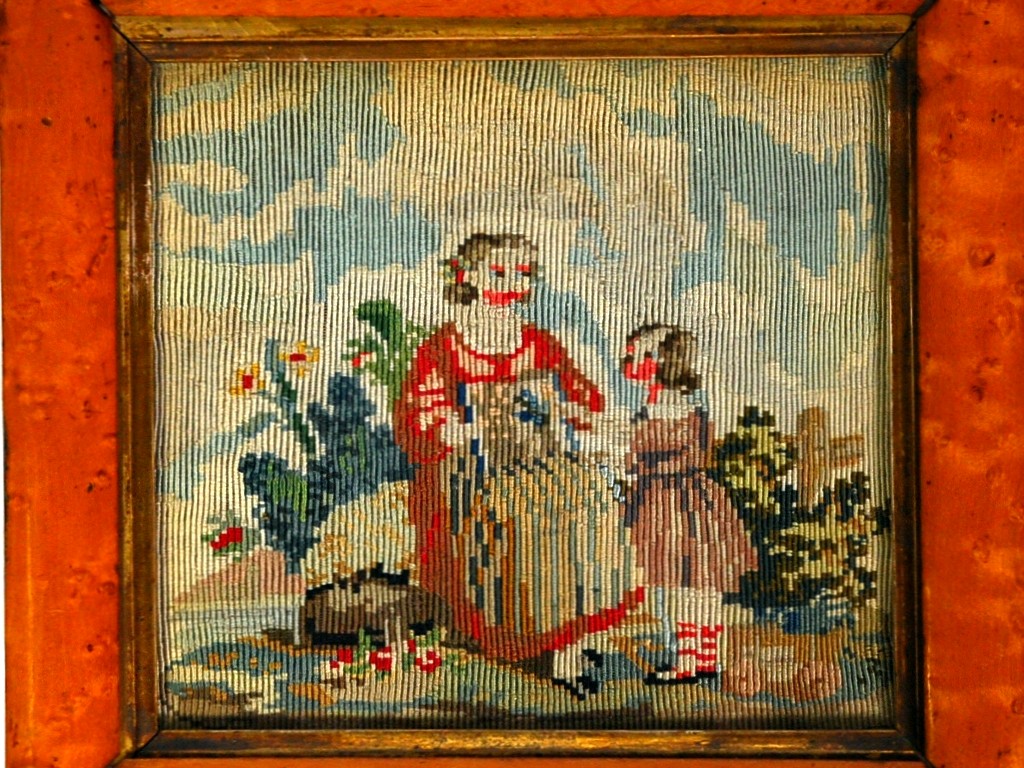 Appraisal: NINETEENTH CENTURY NEEDLEWORK PICTURE depicting Mother and small girl in