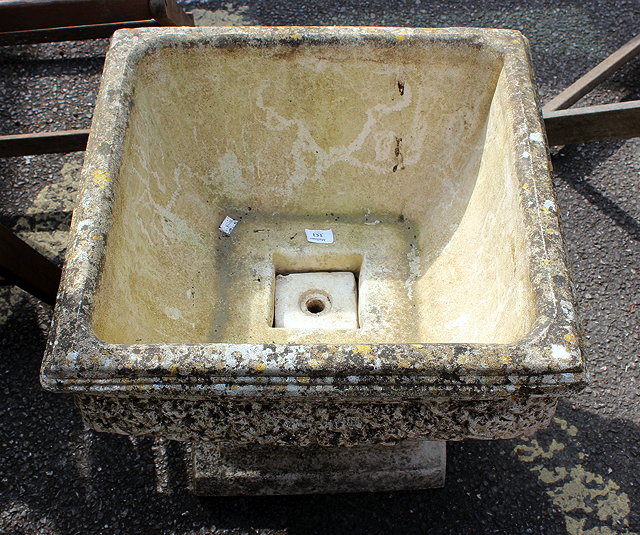 Appraisal: A COMPOSITE STONE SQUARE PLANTER on a stepped square base