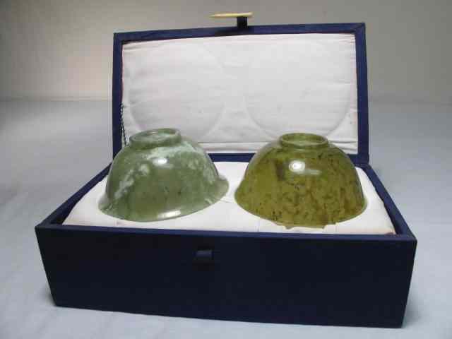 Appraisal: Two carved Jade bowls in a decorative case Bowls are