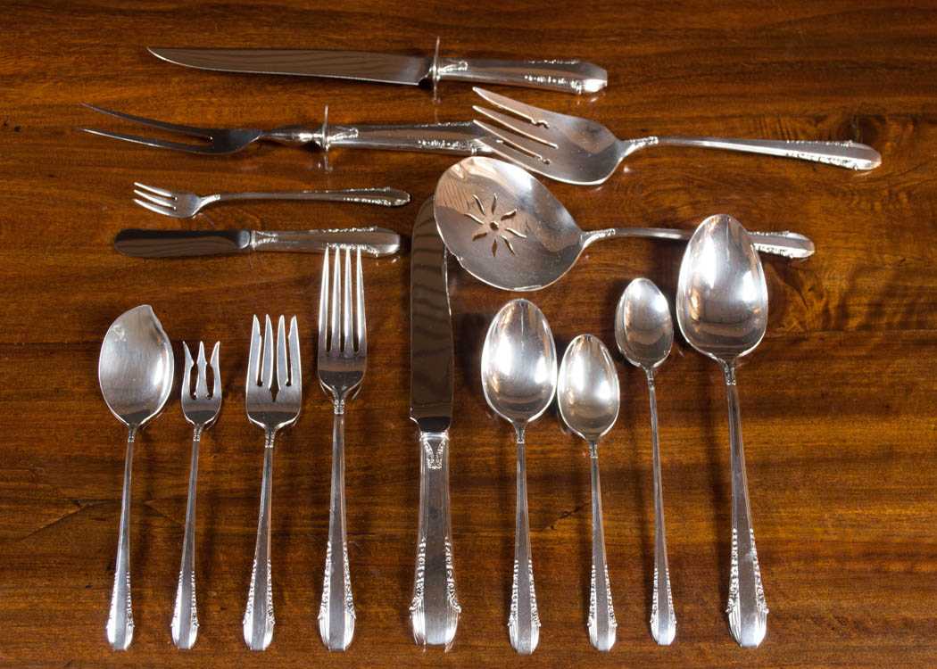 Appraisal: INTERNATIONAL ENCHANTRESS STERLING SILVER FLATWARE SET one hundred twenty-eight pieces