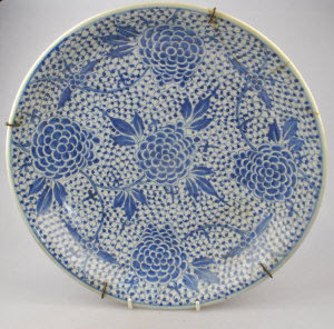 Appraisal: Chinese blue and white saucer dish decorated with peony early