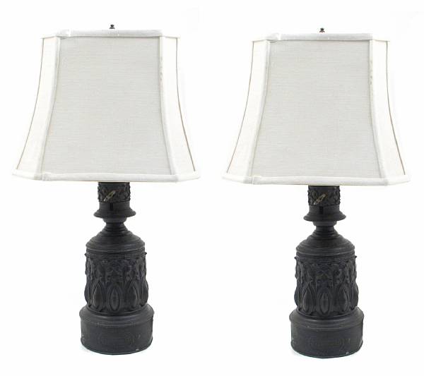 Appraisal: A pair of French tole repousse decorated table lamps height