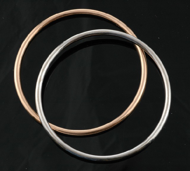 Appraisal: A pair of gold bangles Comprising a ct white gold