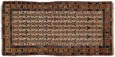 Appraisal: Kurdish rug repeating designs on ivory field camel and blue