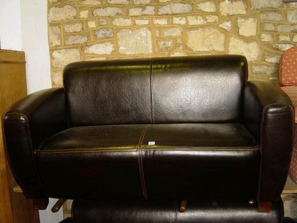 Appraisal: A good quality Art Deco style dark brown leather upholstered