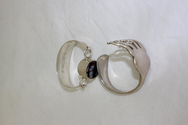 Appraisal: A CONTEMPORARY SILVER BANGLE a blue John type inset stone