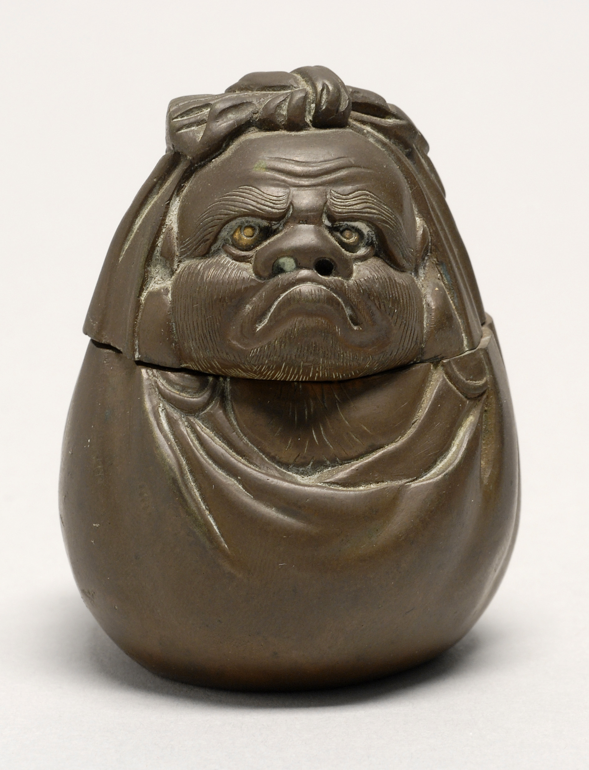 Appraisal: SENTOKU BRONZE MATCH HOLDER Meiji PeriodIn the form of Daruma