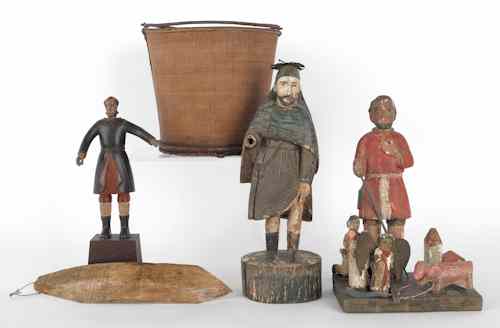 Appraisal: Three carved and painted religious figures together with a basket