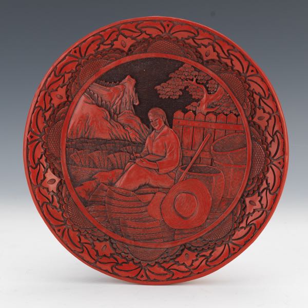 Appraisal: CHINESE CARVED CINNABAR LACQUERED PLATE Plate in low relief of