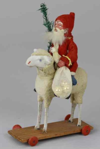 Appraisal: SANTA CANDY CONTAINER ON LAMB Germany Santa Claus dressed in