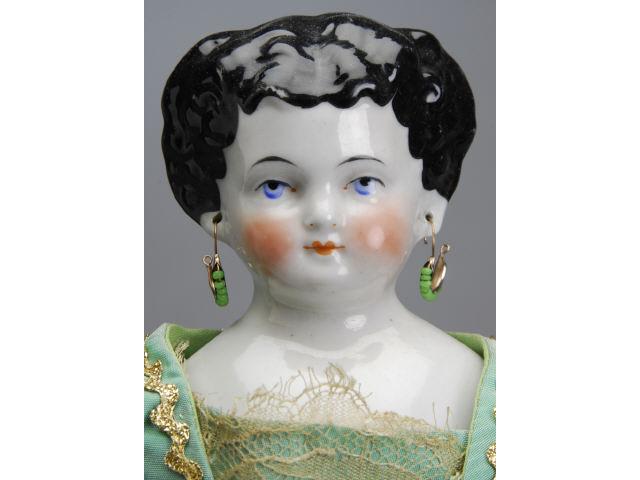 Appraisal: China Lady with Pierced Ears Germany ca glazed porcelain shoulder