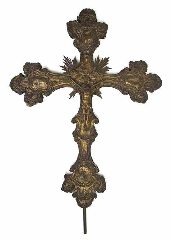 Appraisal: A Continental Pressed Metal and Gilt Cross centered with an