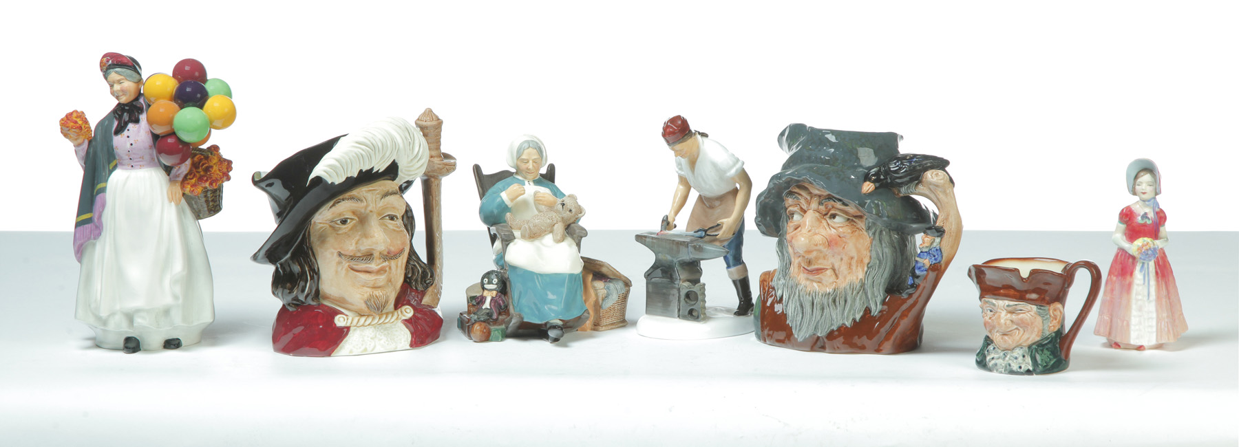 Appraisal: SEVEN PIECES OF ROYAL DOULTON INCLUDING FOUR FIGURINES AND THREE