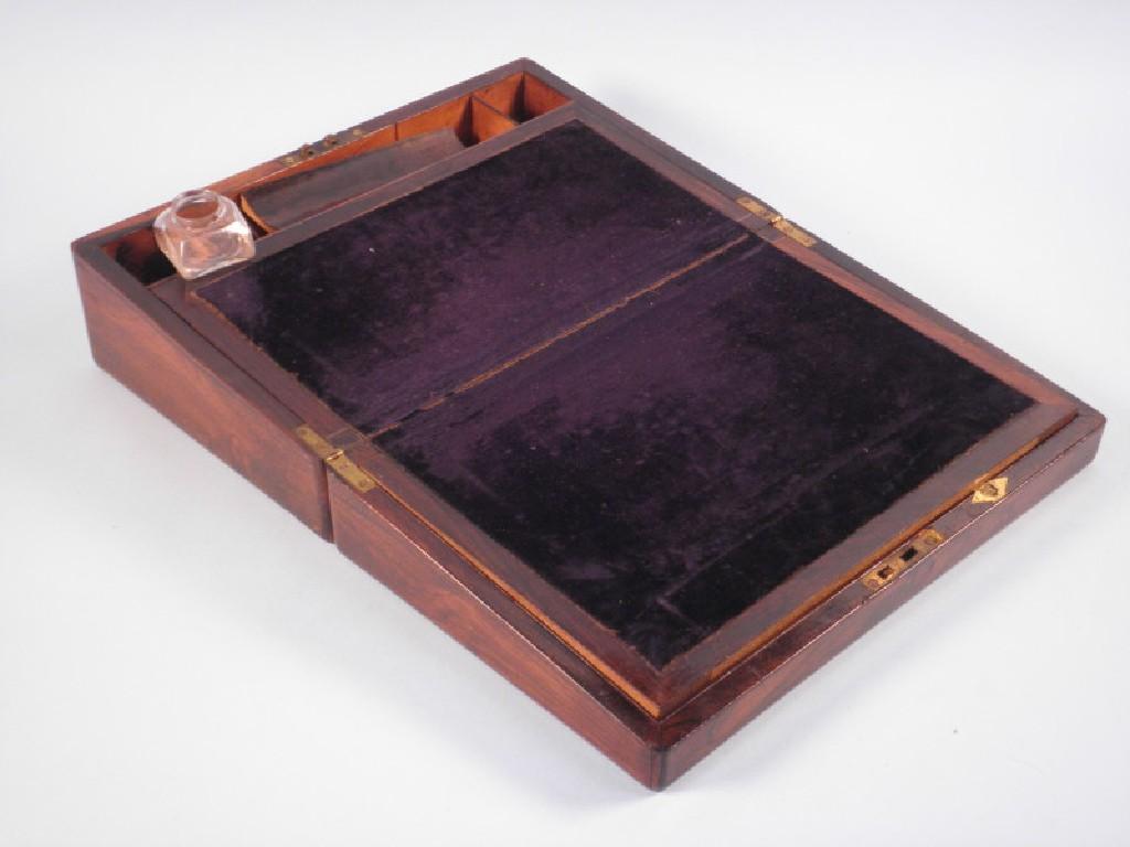 Appraisal: A Victorian rosewood writing box the hinged lid enclosing a