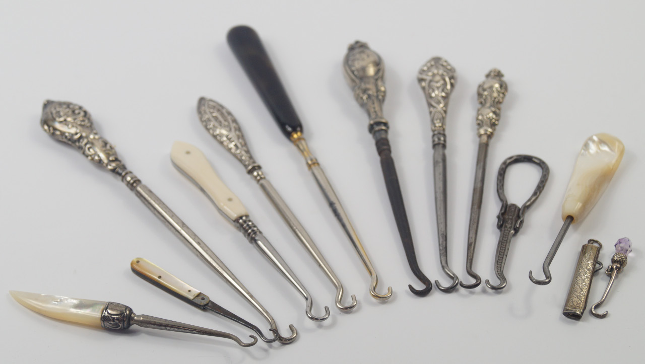 Appraisal: Five Victorian and Edwardian button hooks with embossed silver handles