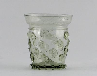 Appraisal: A Continental green-tinted beaker or krautstrunk with applied prunts below