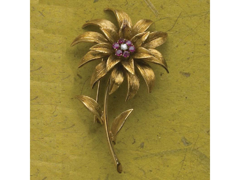 Appraisal: GOLD RUBY AND DIAMOND BROOCH sunflower design with six melee