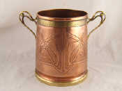 Appraisal: An Art Nouveau ice bucket the embossed copper body with