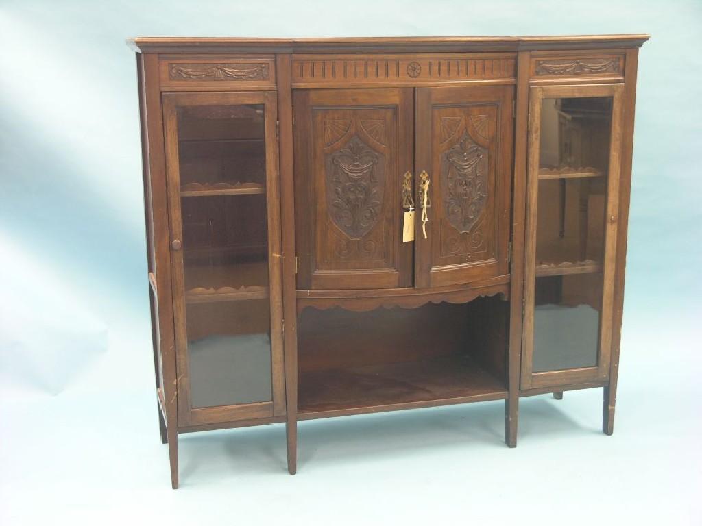 Appraisal: A Victorian walnut chiffonier pair of central carved doors flanked