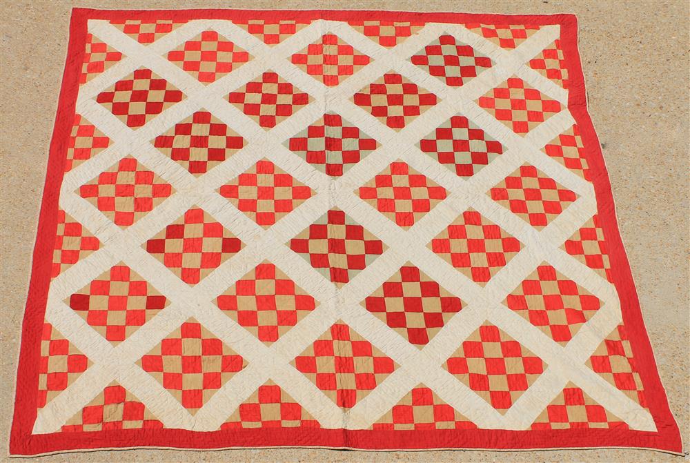 Appraisal: IRISH SQUARE RED TAUPE AND OFF- WHITE COTTON QUILT hand