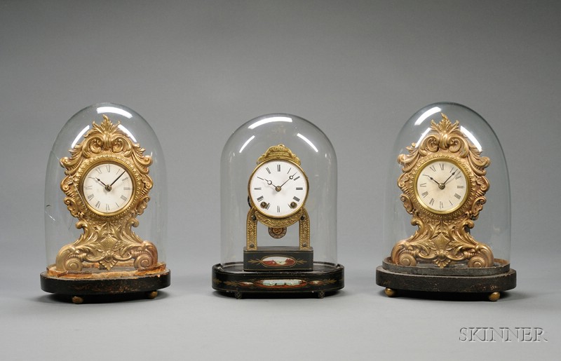 Appraisal: Group of Three Miniature Clocks Under Glass Domes one marked