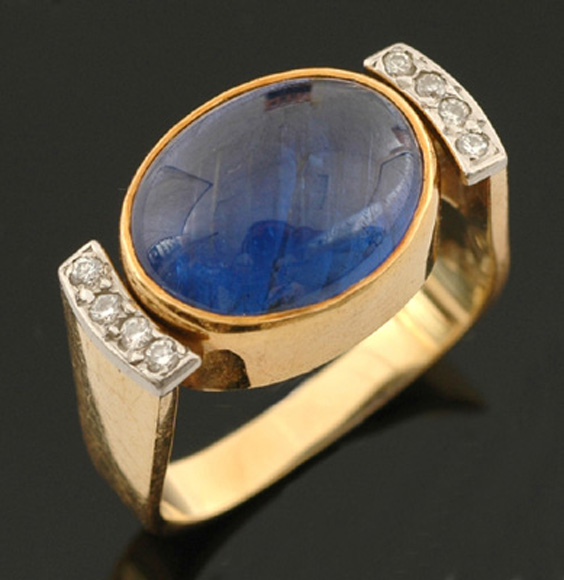 Appraisal: A sapphire and diamond ring Of contemporary design set with