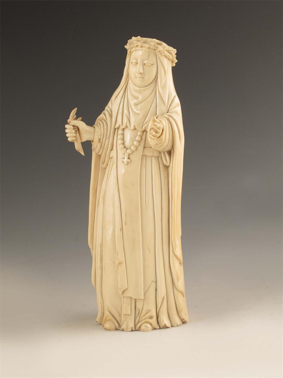 Appraisal: A carved ivory model of St Catherine of Siena