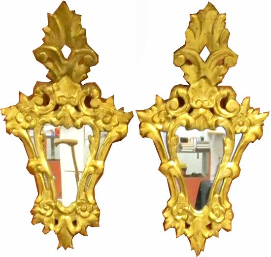 Appraisal: Pair gilt shield form wall mirrors feather and scroll over