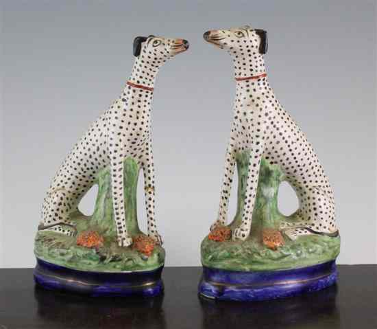 Appraisal: A pair of Staffordshire figures of Dalmatians c each seated