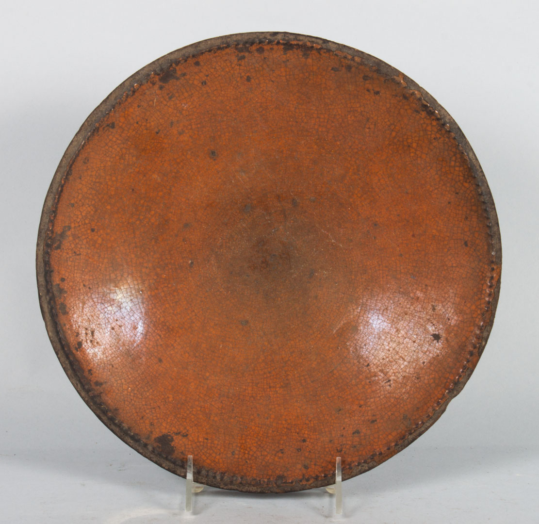 Appraisal: American redware plate second quarter- th century in Diam Condition