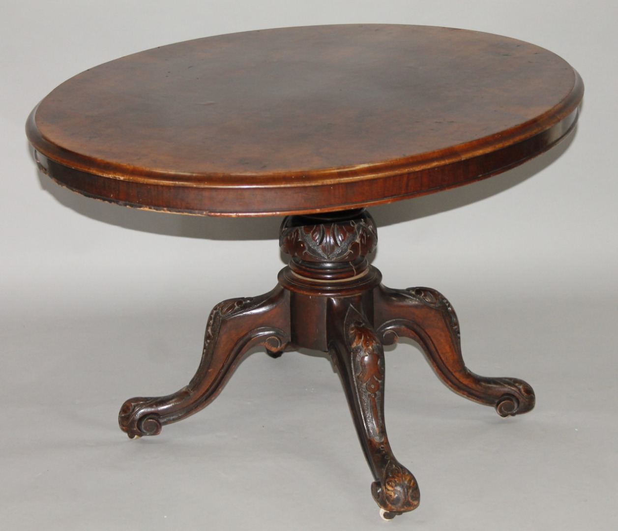 Appraisal: A thC walnut loo table the oval moulded top on