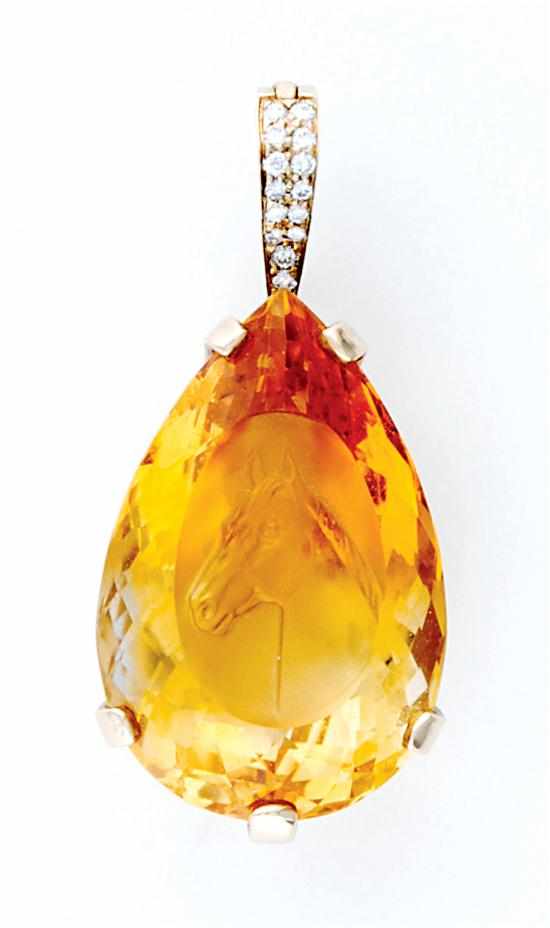 Appraisal: Citrine and diamond pendant pear-shape citrine carved and etched with