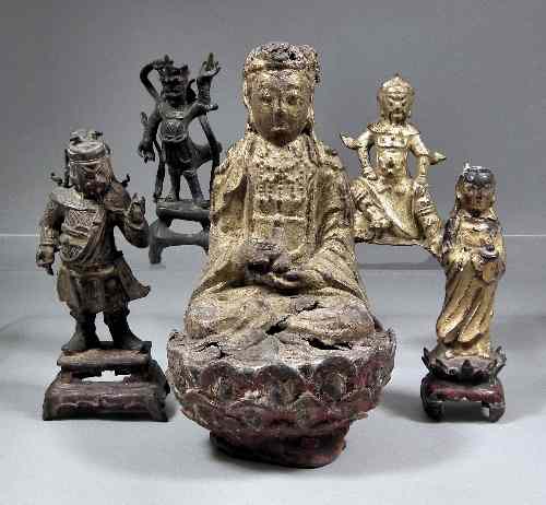 Appraisal: An Eastern gilded soft metal figure of a seated Buddha