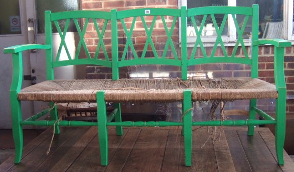 Appraisal: A Continental green painted three seat bench with rush seat