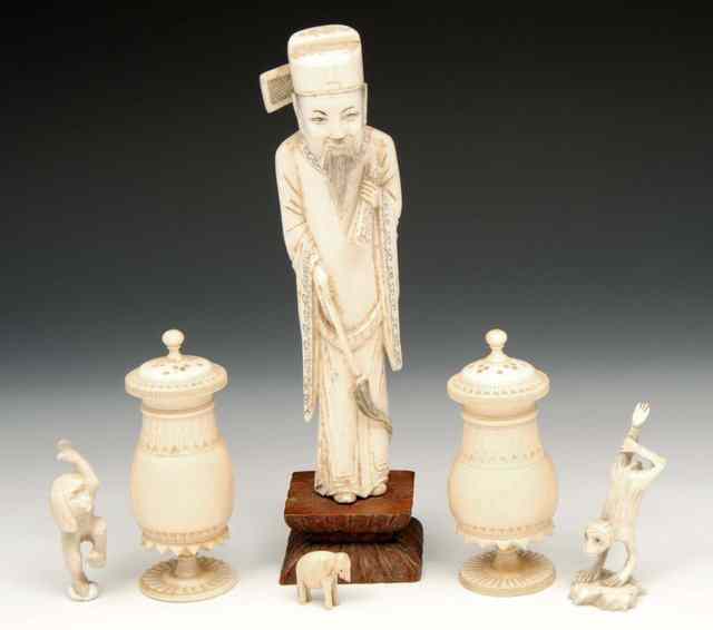 Appraisal: A CHINESE IVORY FIGURE OF A COURTIER HOLDING KAEI and