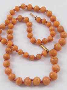 Appraisal: A graduated coral bead necklace largest bead approx mm diameter