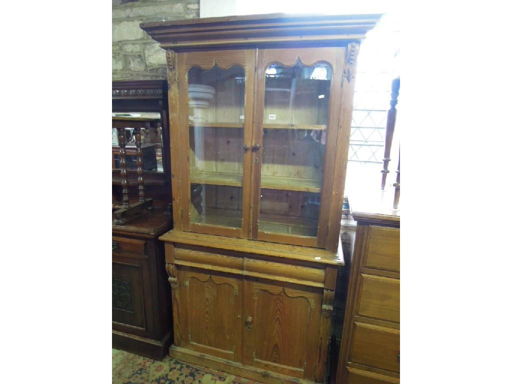 Appraisal: A Victorian stripped pine chiffonier bookcase the upper section with