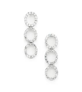 Appraisal: A PAIR OF THREE-CIRCLE DIAMOND EARRINGS Set in palladium each