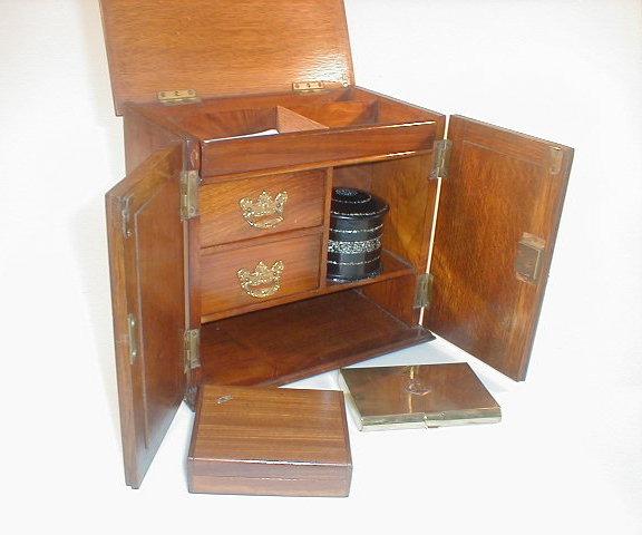 Appraisal: An Edwardian oak smokers cabinet with locker top and two