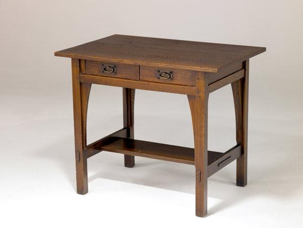 Appraisal: GUSTAV STICKLEY Two-drawer library table with hammered copper oval pulls