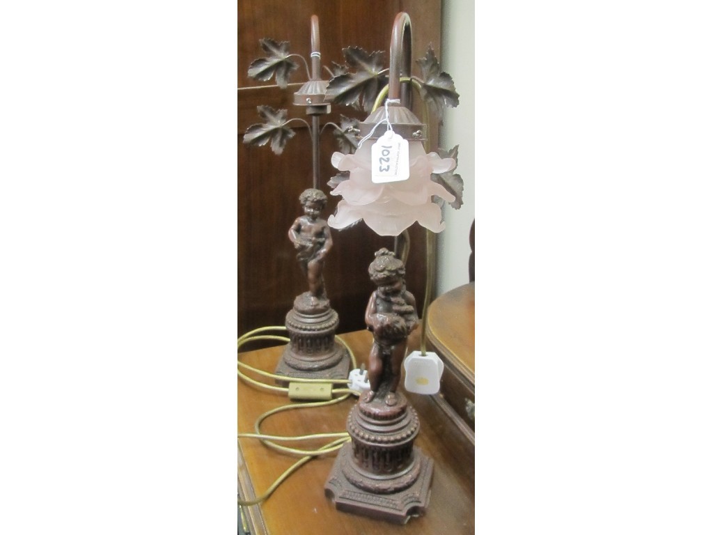 Appraisal: Pair of modern cherub decorated table lamps