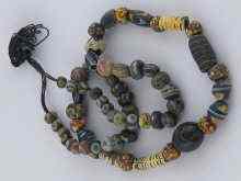 Appraisal: An ancient glass bead necklace length cm probably circa BC