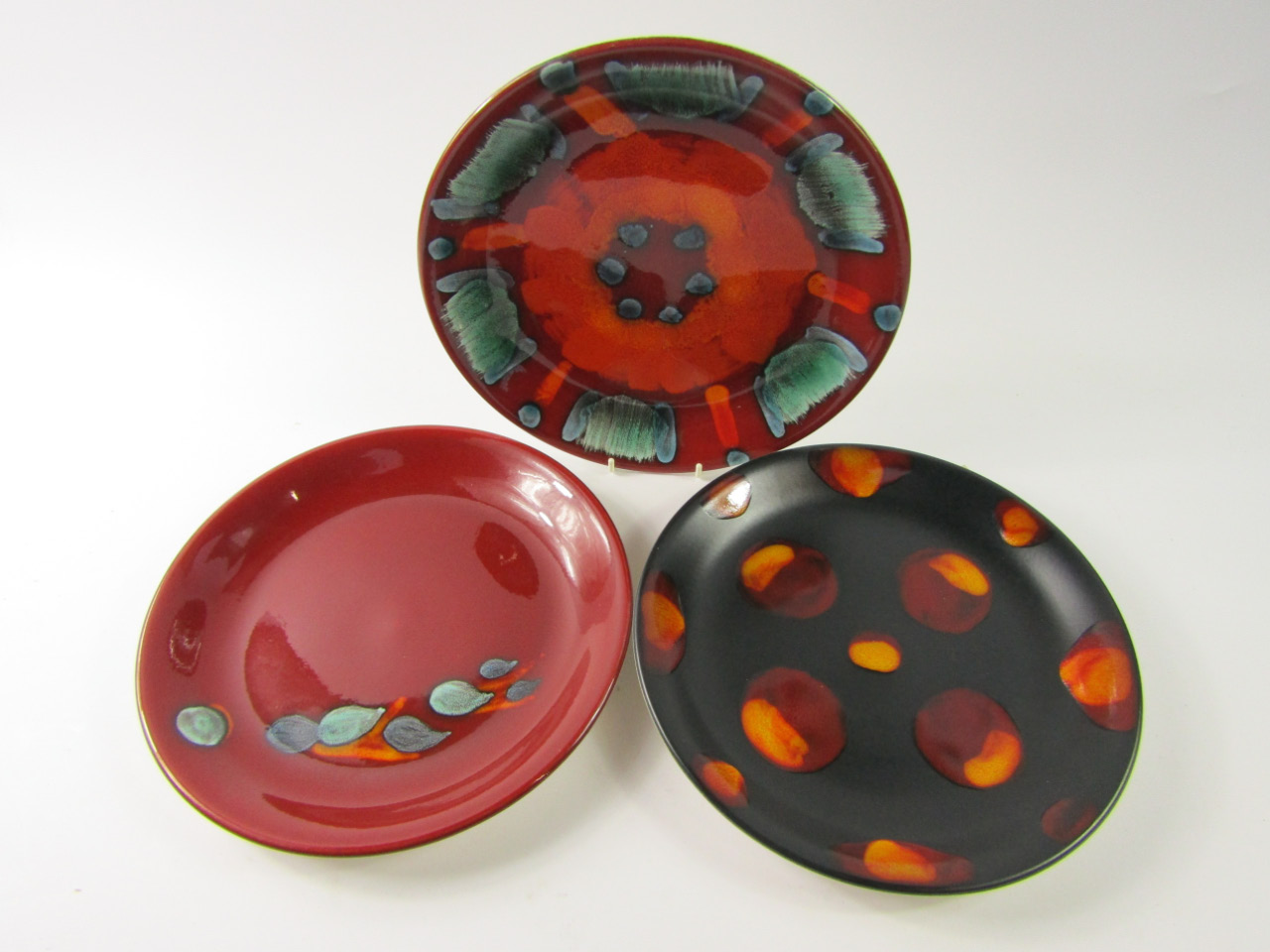 Appraisal: Two Poole Pottery Delphis dishes cm diameter together with a